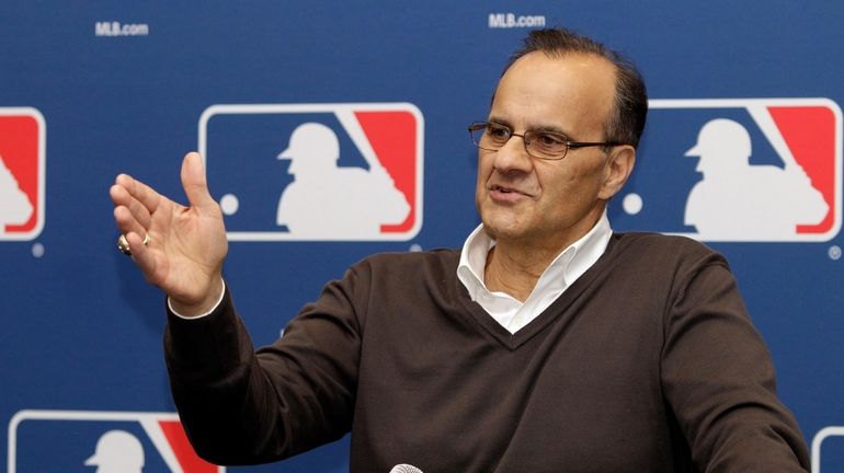 Joe Torre fields questions during a news conference to announce...