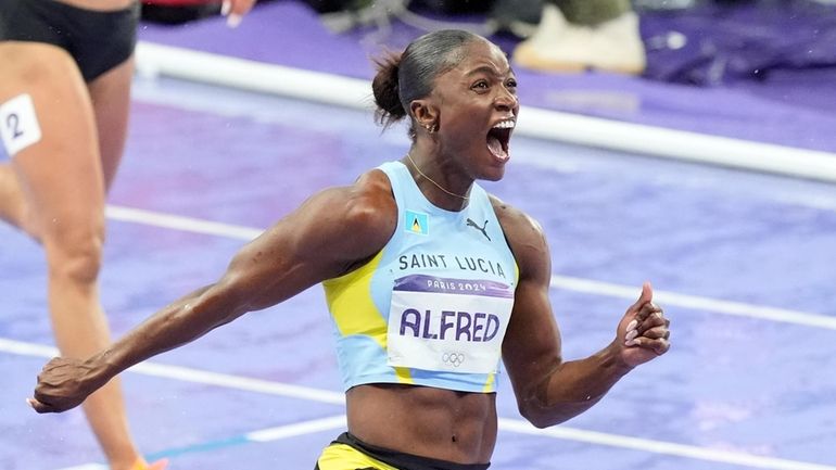 Julien Alfred, of Saint Lucia, celebrates after winning the women's...