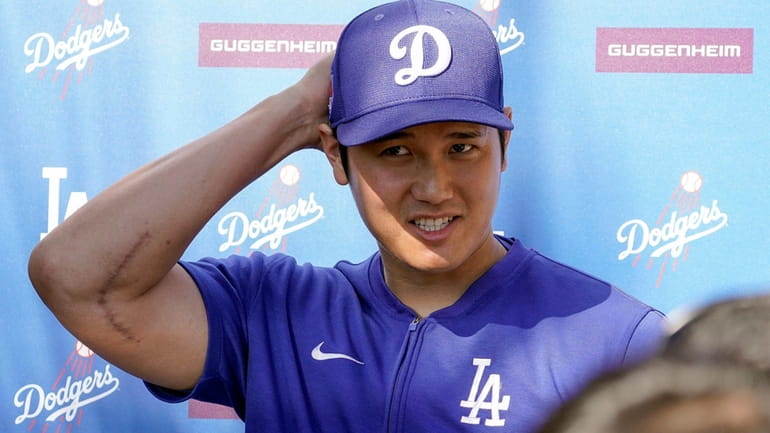 Los Angeles Dodgers' Shohei Ohtani addresses the media about his...