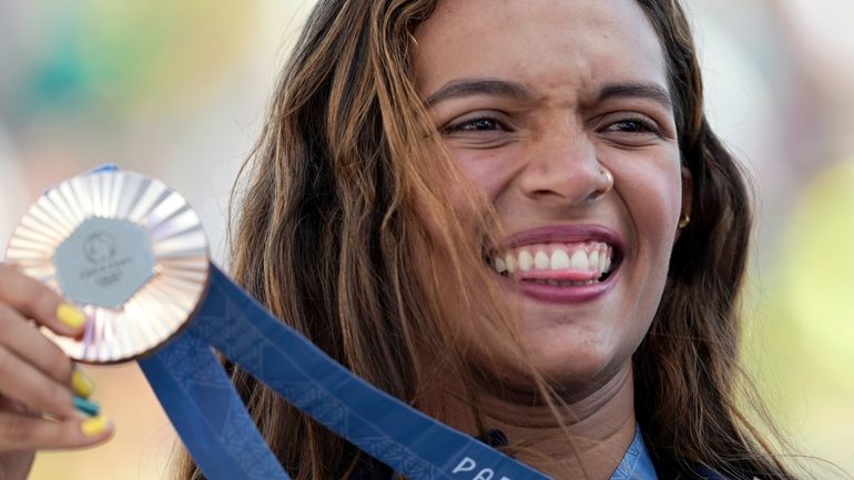 Rayssa Leal, of Brazil, poses with her bronze medal after...