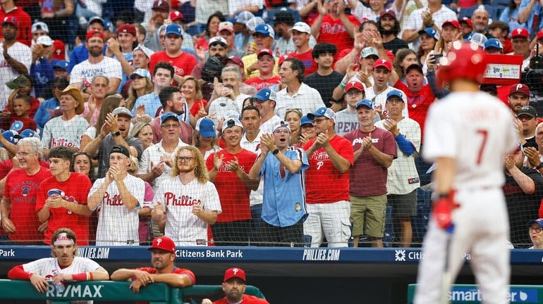 Trea Turner of the Phillies gets a standing ovation from...