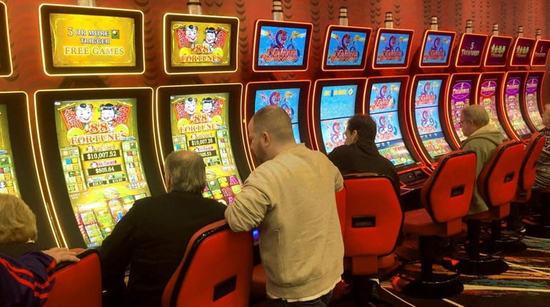 Patrons play the machines at Jake's 58 hotel video lottery...