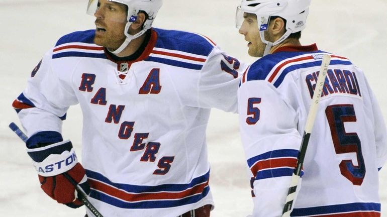 Brad Richards, left, celebrates his goal with defenseman Dan Girardi,...