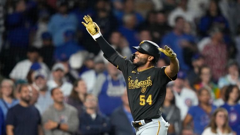 Pittsburgh Pirates' Joshua Palacios celebrates his pinch-hit, three-run home run...