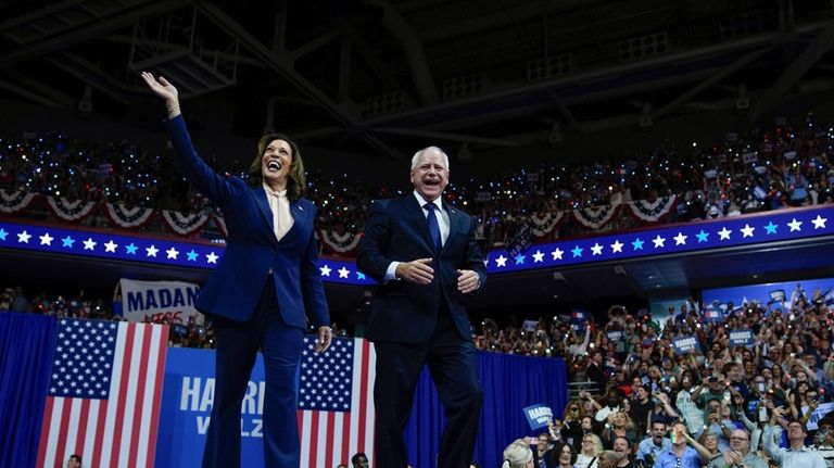 Democratic presidential nominee Vice President Kamala Harris and her running...