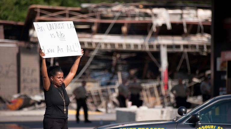 Protesters appeal to motorists for support while rallying on Monday,...