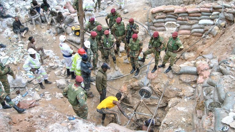 Zambian Army special forces officers follow the rescue operation of...