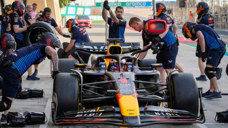 Red Bull driver Max Verstappen of the Netherlands gets a...