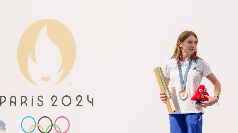 Romanian gymnast Ana Barbosu poses with the bronze medal for...