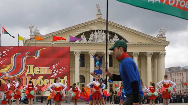 Schoolchildren perform at a ceremony marking Belarus’ holiday honoring the...