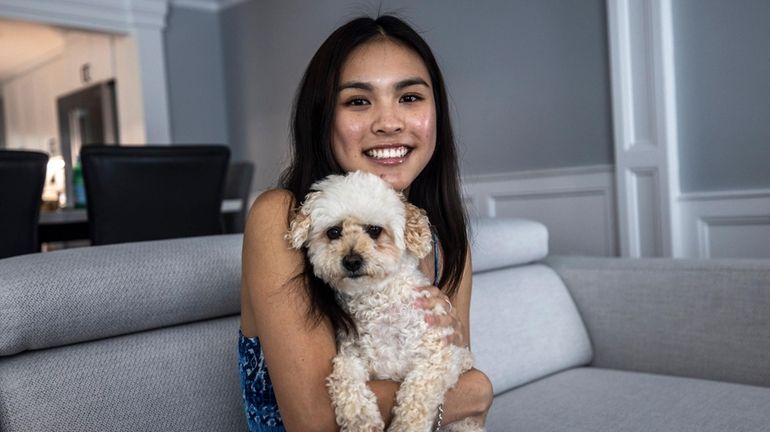 Audrey Chen with her rescue dog, Payton, at her home in...