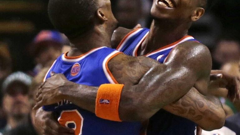 Knicks small forward Iman Shumpert, right, is embraced by teammate...