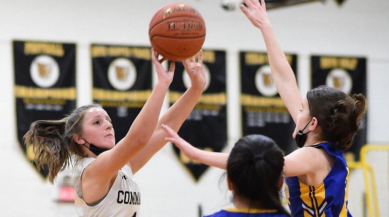 Sofia Vasselman #1 of Commack, left, shoots a jumper as...