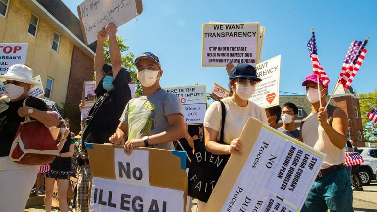 Demonstrators at Oyster Bay Town Hall protest plans to open...