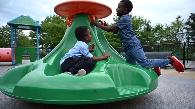 Cousins Horace Michael and Noah Bryan, of North Woodmere, play...