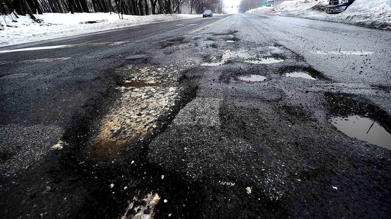 Potholes in the eastbound lanes of Route 25A in Roslyn...