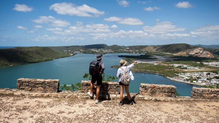 Visitors hike at Guánica State Forest in Puerto Rico.