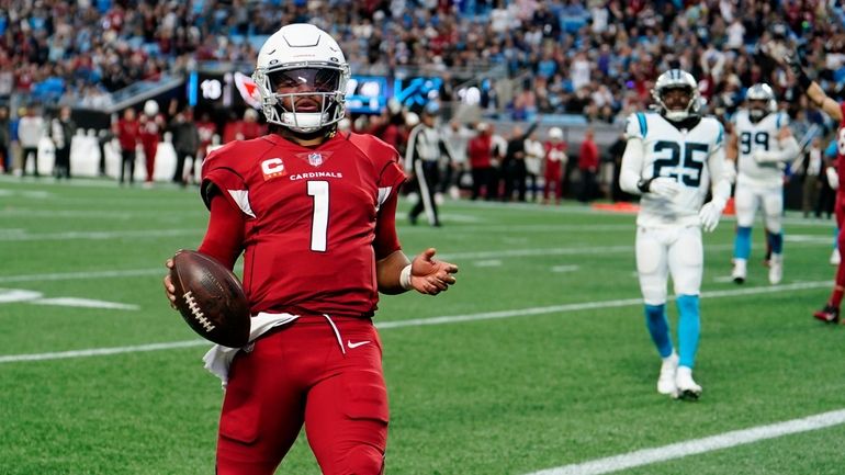 Arizona Cardinals quarterback Kyler Murray scores against the Carolina Panthers...