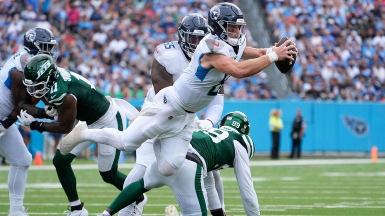 Tennessee Titans quarterback Will Levis (8) fumbles the ball in...