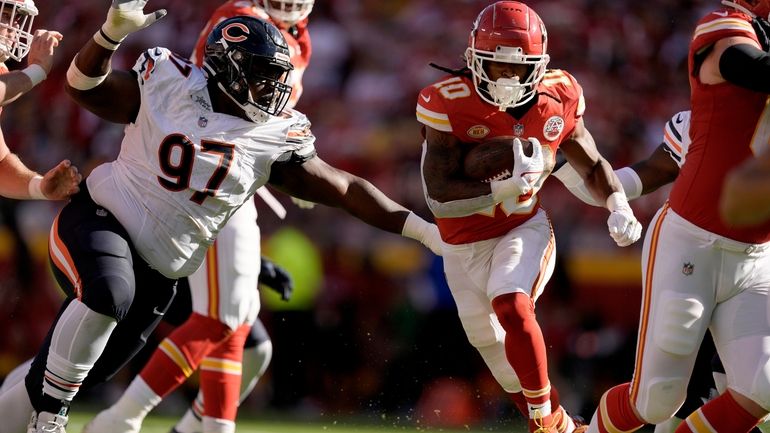 Kansas City Chiefs running back Isiah Pacheco (10) runs with...