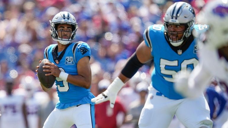 Carolina Panthers quarterback Bryce Young (9) drops back to pass...