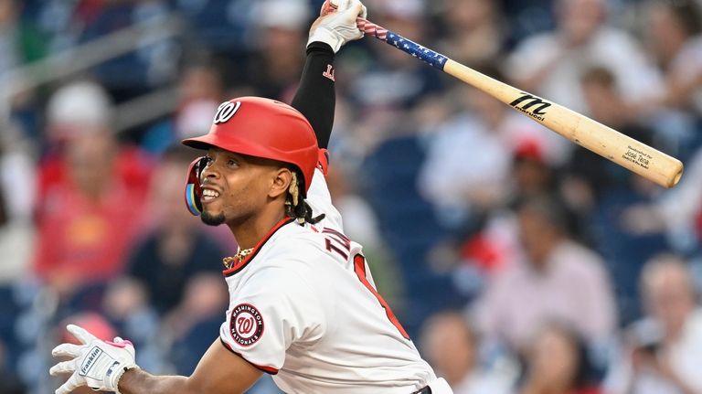 Washington Nationals' Jose Tena watches his two-run RBI double go...