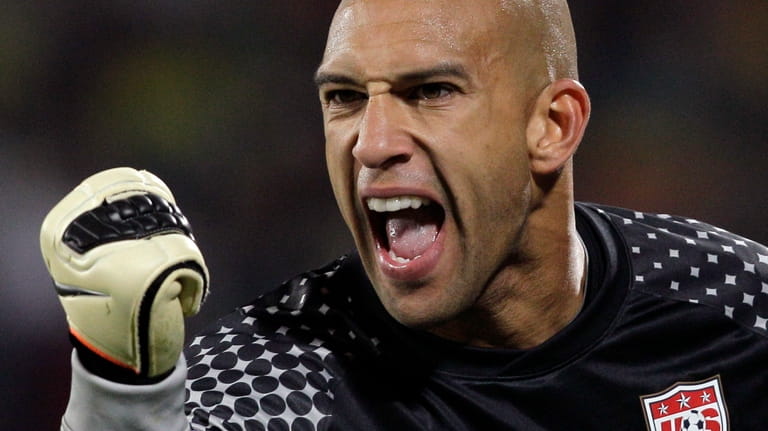 United States goalkeeper Tim Howard clenches his fist during the...