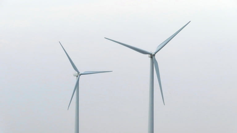 Land-based wind turbines in Atlantic City, N.J., turn on July...