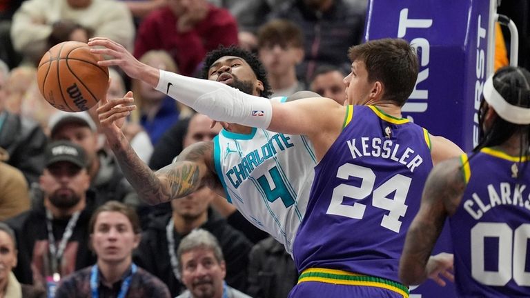 Utah Jazz center Walker Kessler (24) fouls Charlotte Hornets center...