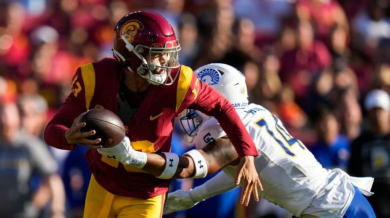 San Jose State offensive lineman Anthony Pardue (74) tries to...