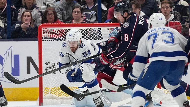 Tampa Bay Lightning center Tyler Motte (64) and Columbus Blue...