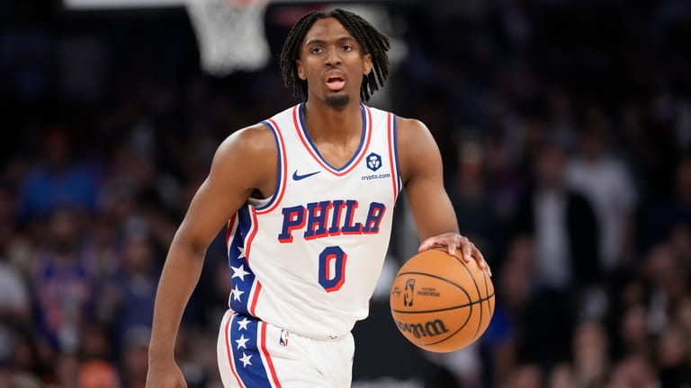 Philadelphia 76ers' Tyrese Maxey (0) looks to pass during the...