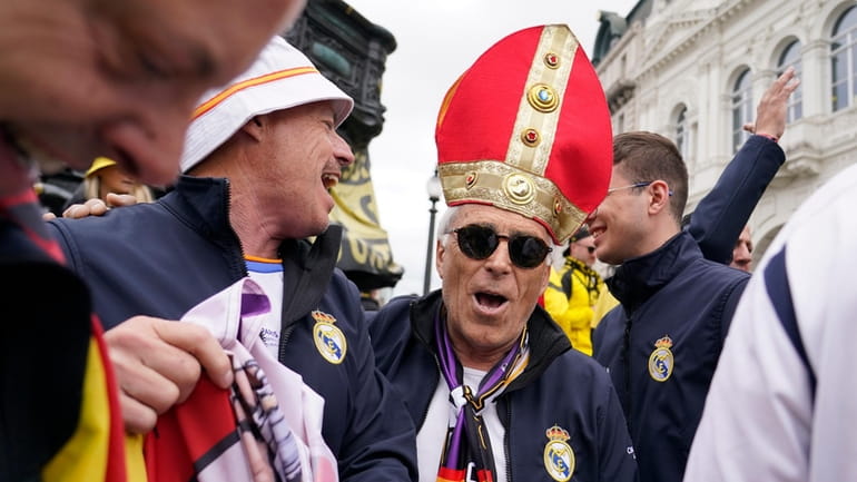 Real Madrid supporters react as they gather near Piccadilly Circus...
