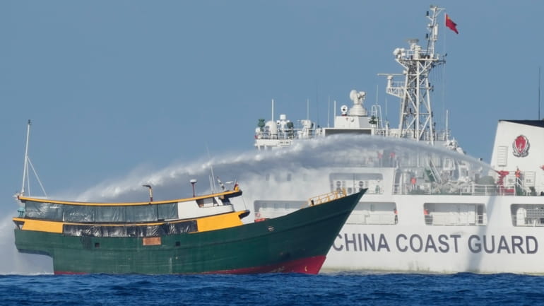 Philippine resupply vessel Unaizah May 4 is hit by Chinese...