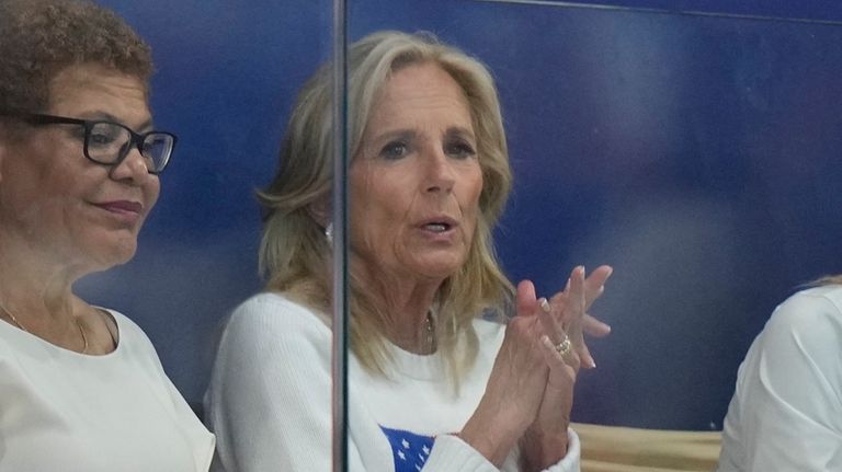 First lady Jill Biden watches a match during a women's...