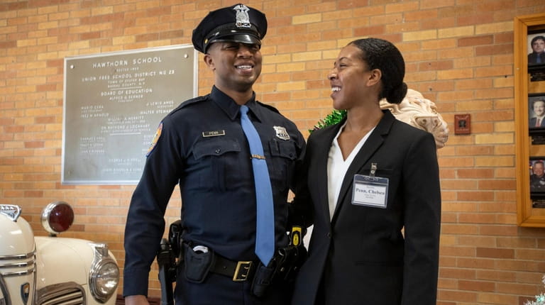 NCPD Officer Derrick Penn with his sister Chelsea Penn, a...