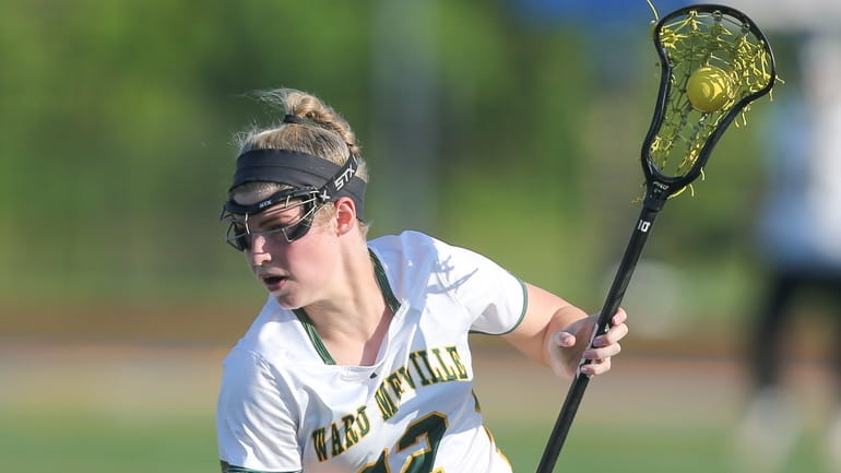 Ward Melville's Grace Mulham (22) moves the ball in the...