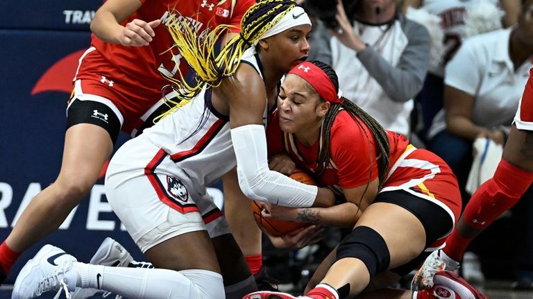 UConn forward Aaliyah Edwards, left, and Maryland guard Brinae Alexander...