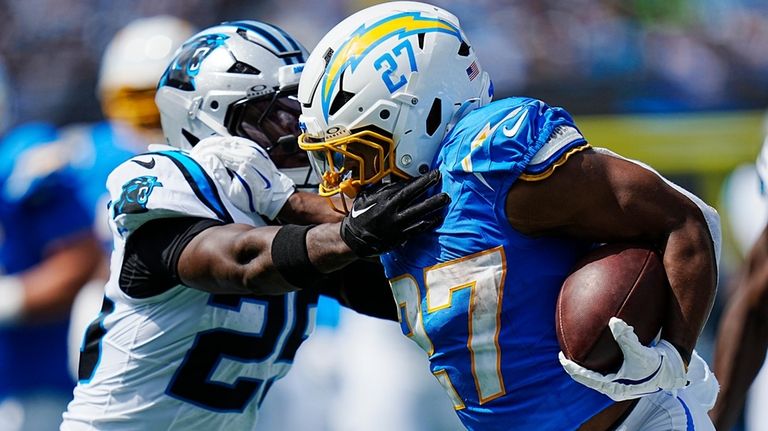 Los Angeles Chargers running back J.K. Dobbins runs for a...