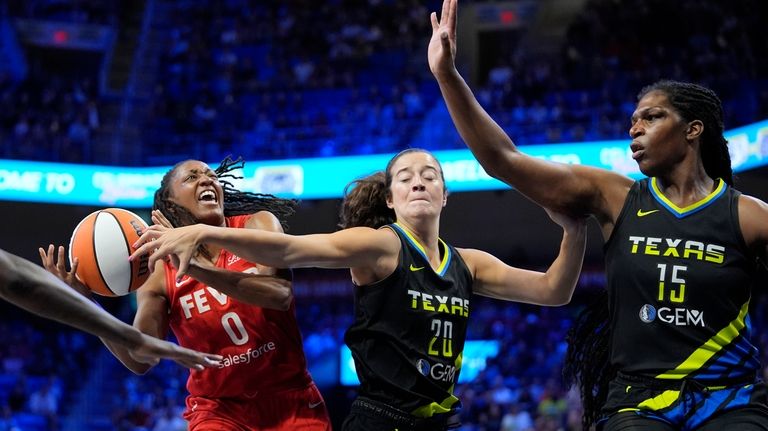 Indiana Fever guard Kelsey Mitchell (0) is fouled while shooting...