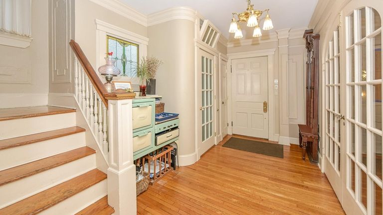 The foyer features an antique piece of stained glass the owners...