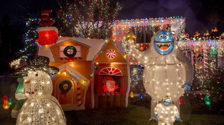 Holiday lights shine bright at the Pfeiffer home at 17...