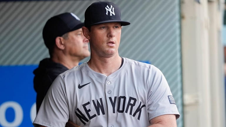Yankees third baseman DJ LeMahieu stands in the dugout before...