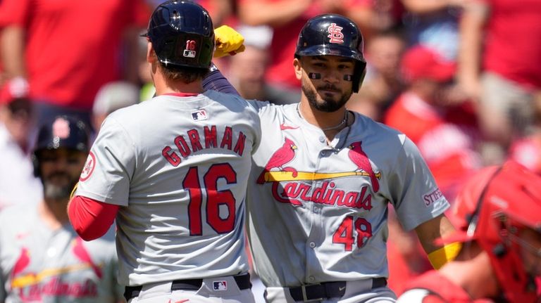 St. Louis Cardinals' Nolan Gorman (16) celebrates with Iván Herrera...