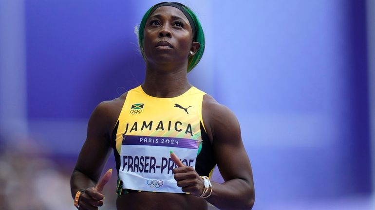 Shelly-Ann Fraser-Pryce, of Jamaica, runs in a women's 100-meter heat...