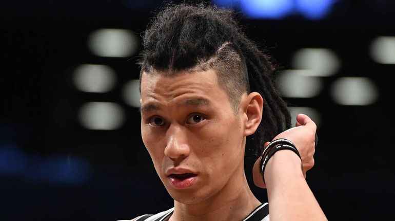 Brooklyn Nets guard Jeremy Lin looks on against the Miami...