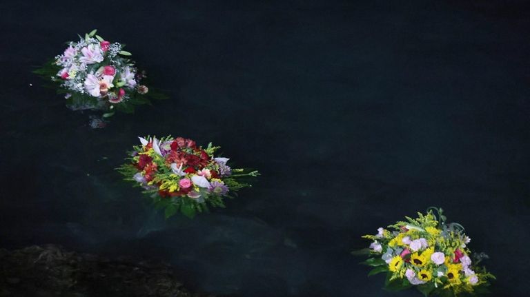 Flowers were sent out to sea as a tribute as...