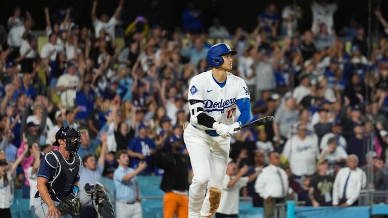 Los Angeles Dodgers designated hitter Shohei Ohtani (17) hits a...