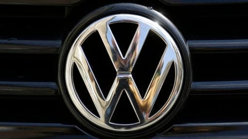 The Volkswagen logo is photographed on a car in Berlin,...