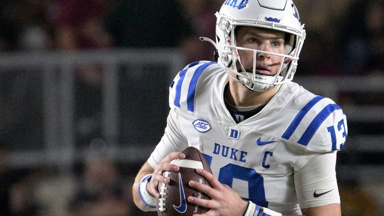 Duke quarterback Riley Leonard (13) looks for a receiver during...